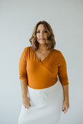 FAUX WRAP BODYSUIT WITH SIDE RUCHING IN AMBER GLOW - Love Marlow
