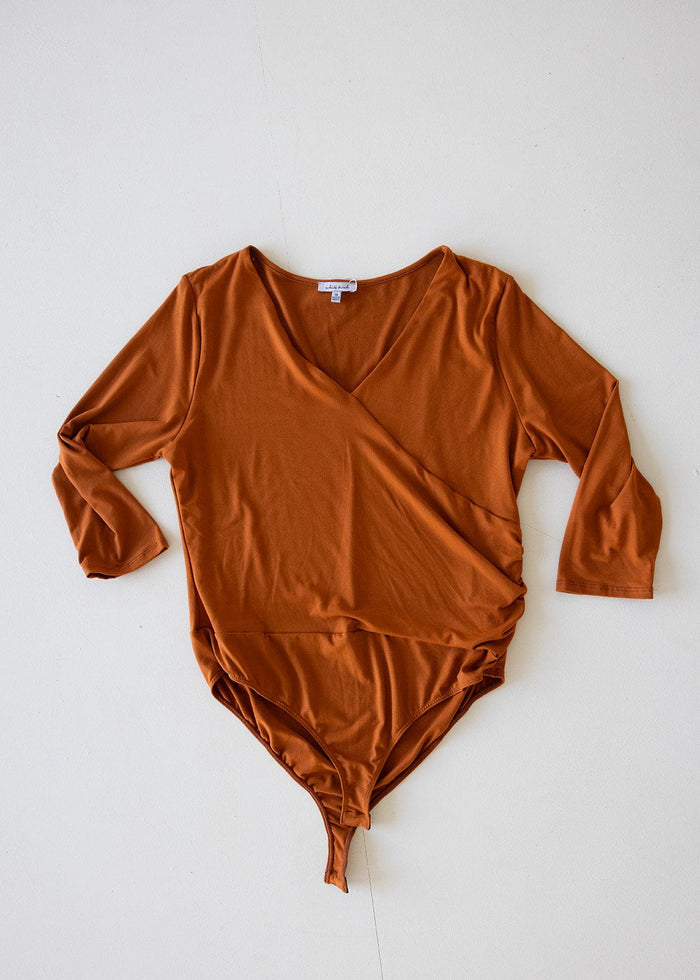 FAUX WRAP BODYSUIT WITH SIDE RUCHING IN AMBER GLOW - Love Marlow