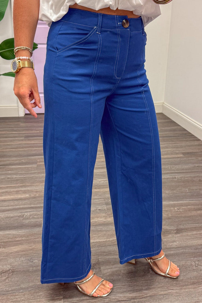 royal blue with white stitching detail button zipper fly closure wide leg pants