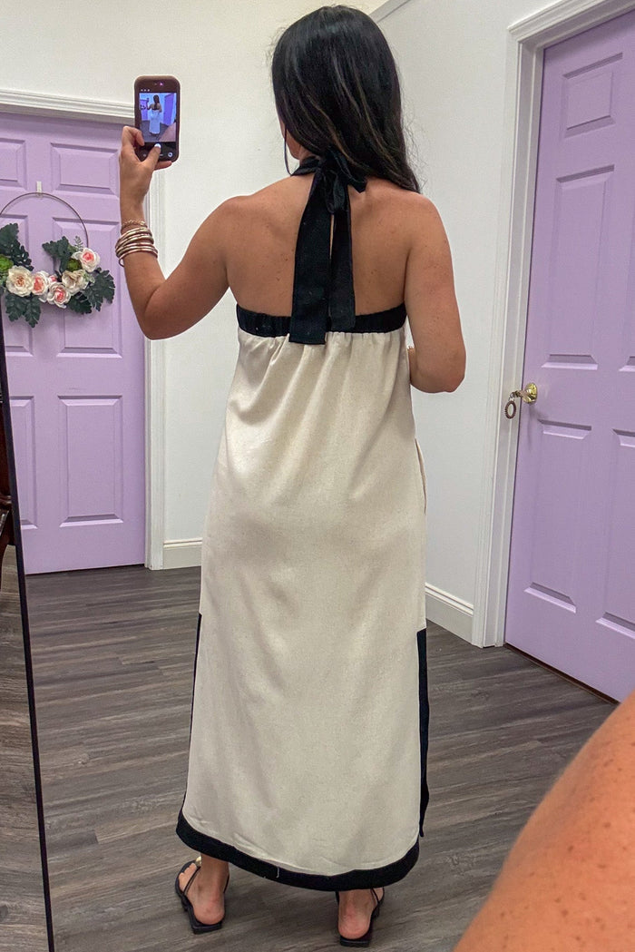 cream with black trim sleeveless halter tie back midi dress
