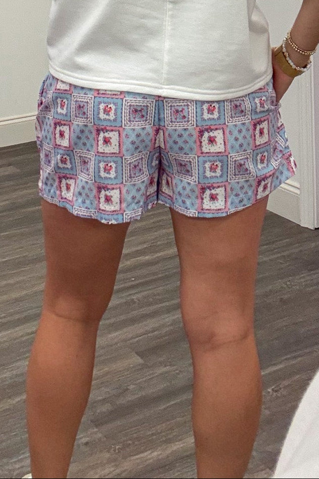 patriotic red white and blue American flags and floral patchwork print shorts