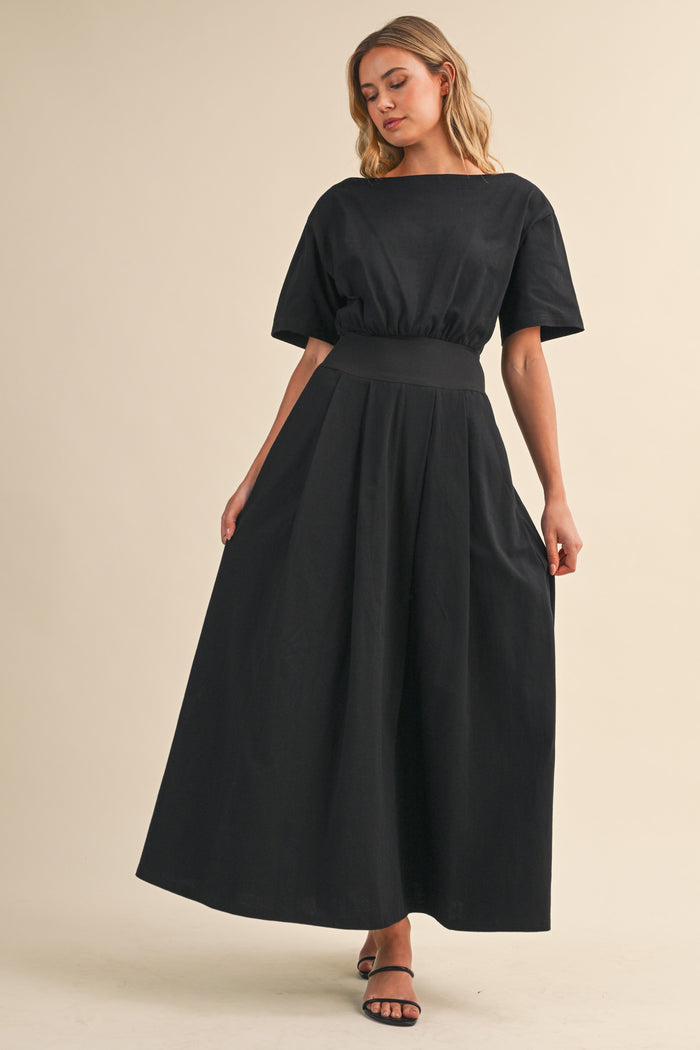 Black midi dress with boat neck and cinched waist by Klesis with a flattering silhouette