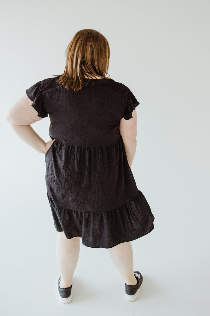 SOLID WOVEN TIERED DRESS WITH FLUTTER SLEEVE IN BLACK - Love Marlow
